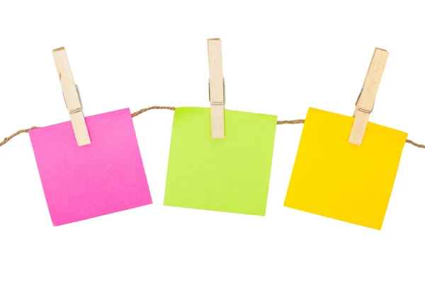 Colorful sticky notes with clothespins isolated on white backgro — Stock Photo, Image