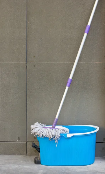 Mop with blue bucket. — Stock Photo, Image