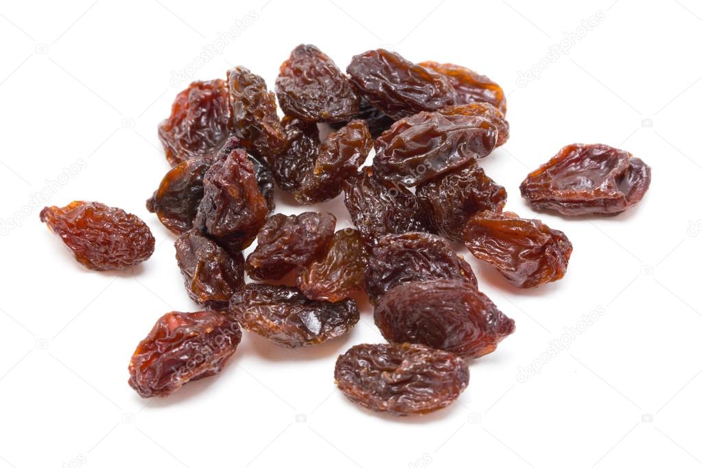 Heap of raisins isolated on white