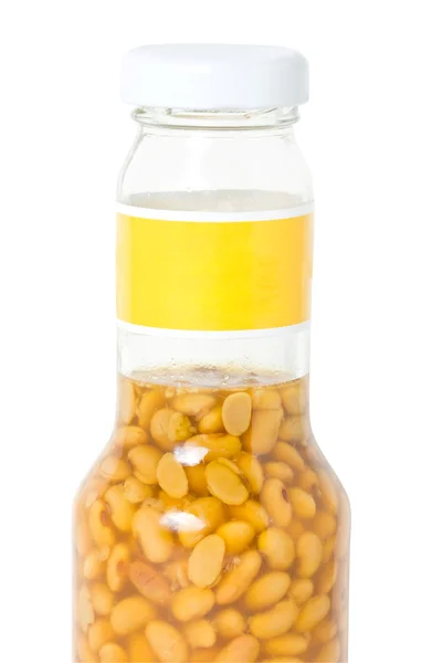 Feijão de soja salgado em garrafa de óculos — Fotografia de Stock