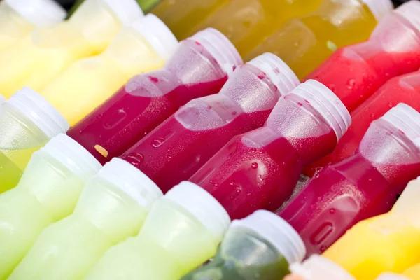 Tropical fruit juice in bottles. — Stock Photo, Image