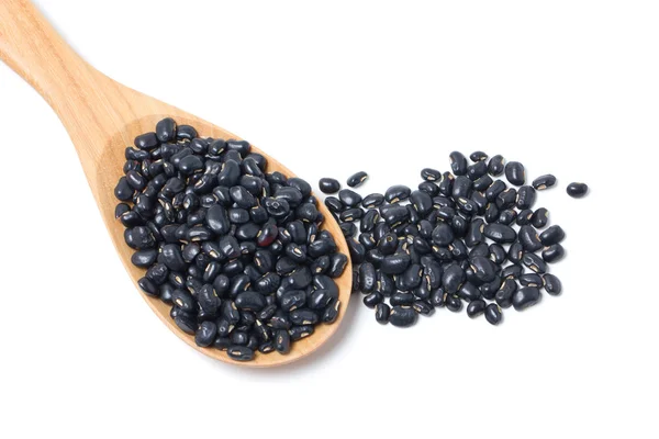 Black beans with wooden spoon — Stock Photo, Image