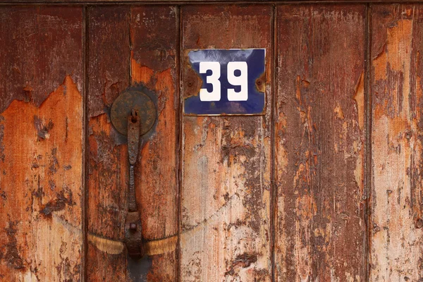 House number on a door — Stock Photo, Image