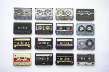 Sofia, Bulgaria - August 12, 2022: Collection of old audio cassette tapes isolated on white background, vintage music and technology concept.