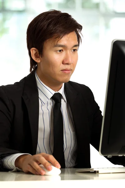 Chinese Businessman working in office