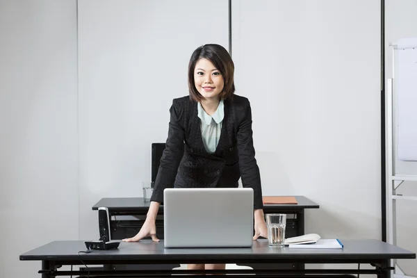 Chinese Business Woman in office.