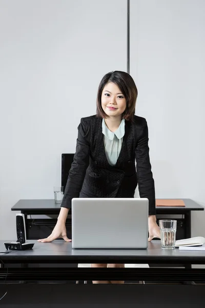 Chinese Business Woman in office.