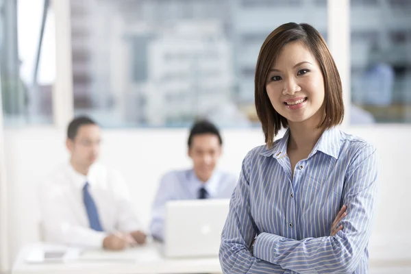 Asian Businesswoman leading a business team