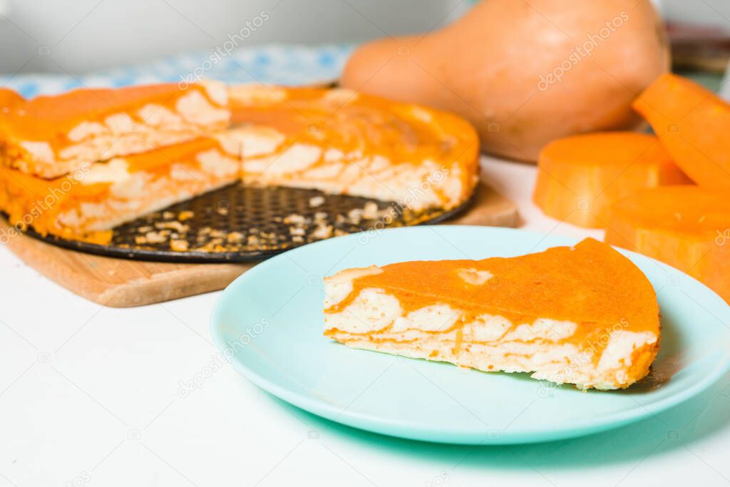 pumpkin casseroles with zebra-shaped cottage cheese, autumn orange pie. cut the pie into pieces on a plate.
