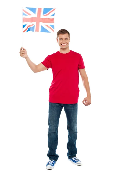 Causal guy waving United Kingdom flag — Stock Photo, Image