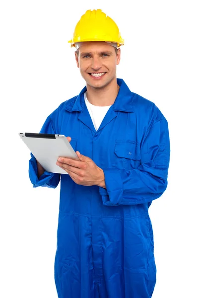 Handsome industrial using wireless tablet device — Stock Photo, Image