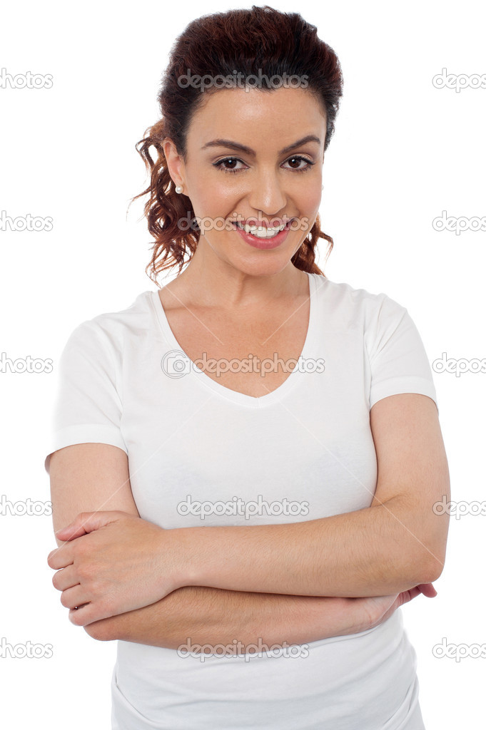 Smiling cheerful woman with her arms crossed