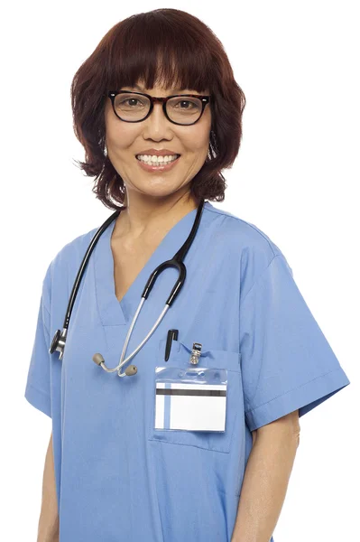 Pleasing female gynecologist posing with stethoscope — Stock Photo, Image