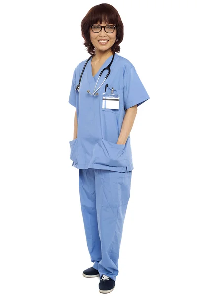 Asian surgeon posing with hands in her uniform — Stock Photo, Image