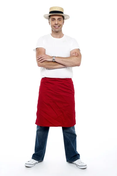 Stylish chap wearing hat. Apron tied on his waist — Stock Photo, Image