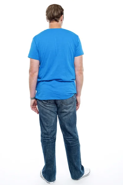 Rear view of casual young guy posing — Stock Photo, Image