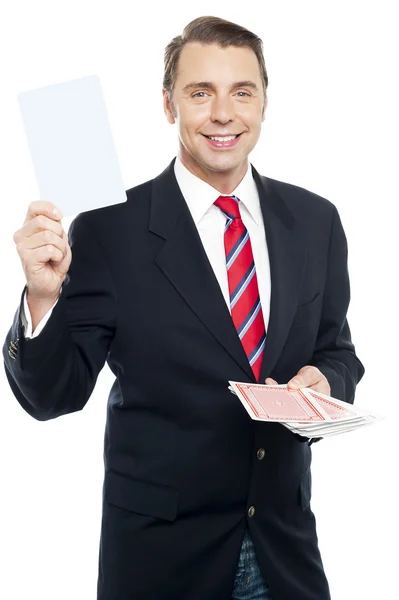 Executive showing blank playing card to camera — Stock Photo, Image