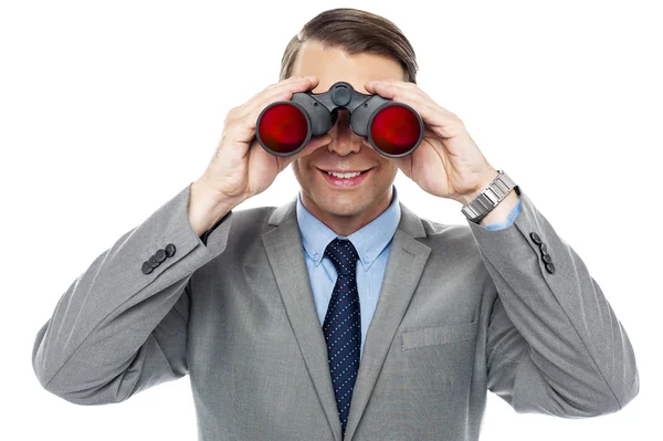 Young officer looking through binoculars — Stock Photo, Image
