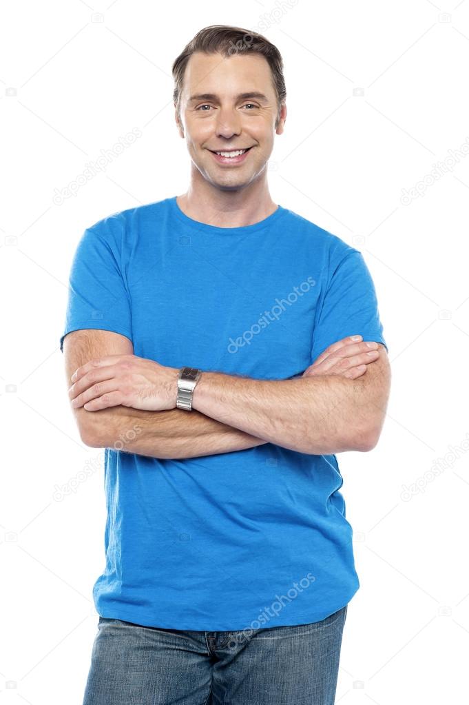Smart young guy posing with arms crossed