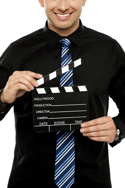 Cropped image of man with clapboard — Stock Photo, Image