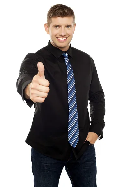 Smart young executive showing thumbs up — Stock Photo, Image