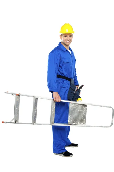 Young repairman ready with stepladder — Stock Photo, Image