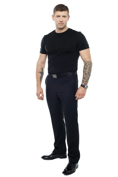Strong male bouncer. Tattoo on both his hands — Stock Photo, Image