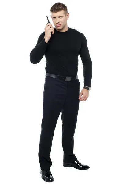 Bodyguard communicating via walkie-talkie — Stock Photo, Image