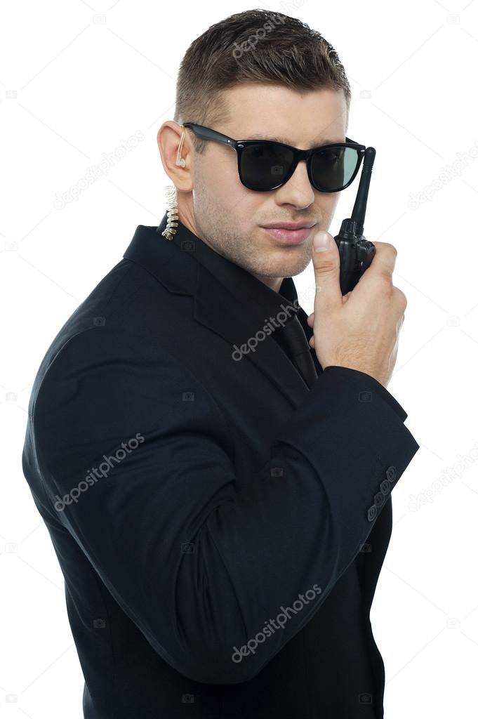 Chief security officer communicating through his walkie-talkie