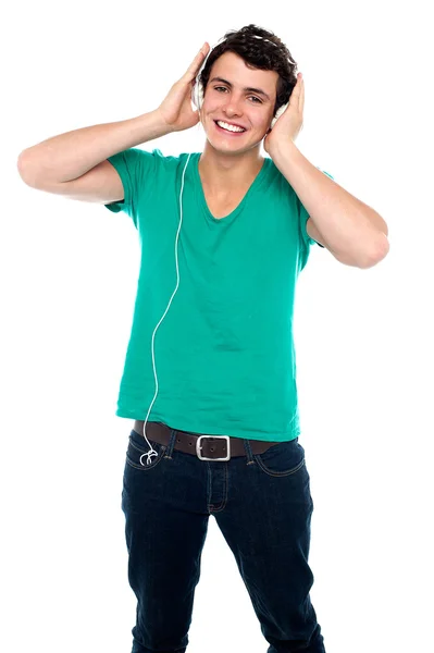 Cheerful guy enjoying loud music — Stock Photo, Image