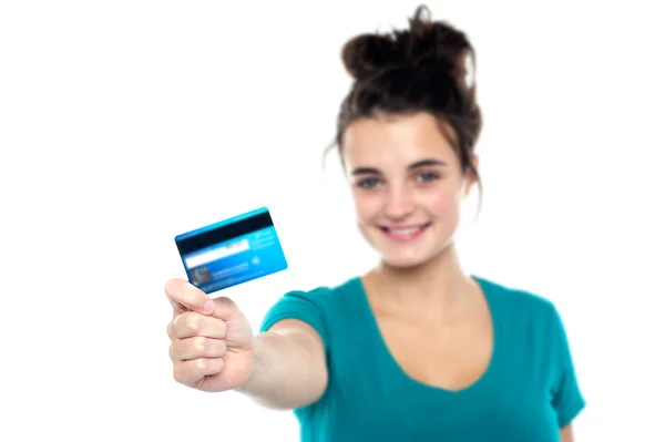 Girl showing her cash card, arm stretched out — Stock Photo, Image