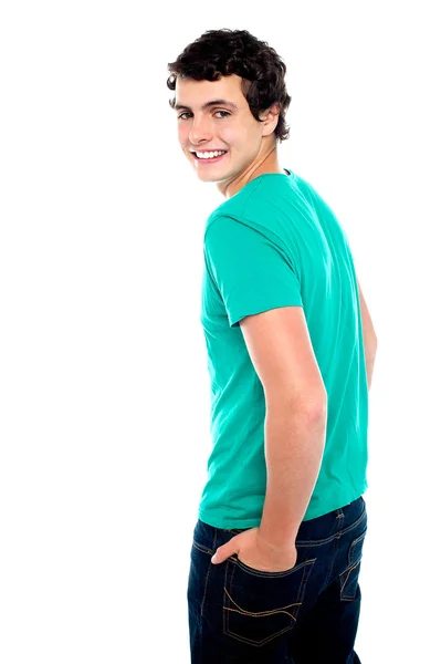 Fashionable young guy turning back — Stock Photo, Image