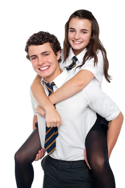 Cheerful shot of youngster riding piggyback — Stock Photo, Image