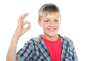 Enthusiastic young student flashing a perfect sign clipart