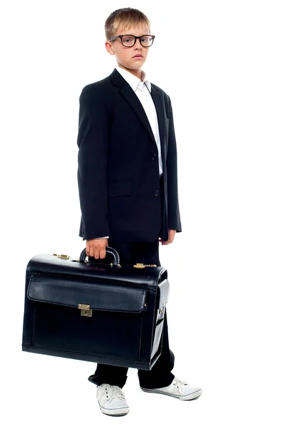 Serious young business boy holding office briefcase — Φωτογραφία Αρχείου