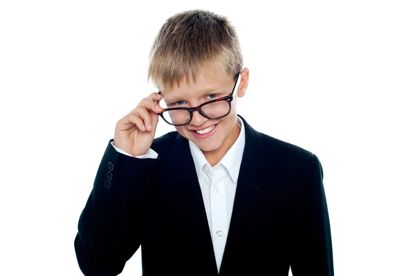Young business boy looking through his glasses — Stock Photo, Image