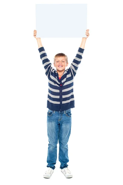 Boy holding banner ad above his head — Stock Photo, Image