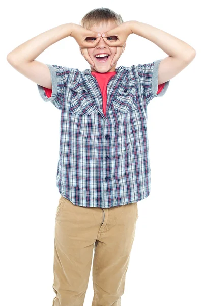 Boy making mock spectacles with his hands — Stock Photo, Image