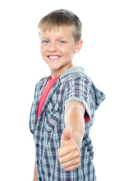 Handsome young boy gesturing thumbs up sign — Stock Photo, Image