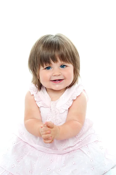Cheerful baby girl in pink frock — Stock Photo, Image