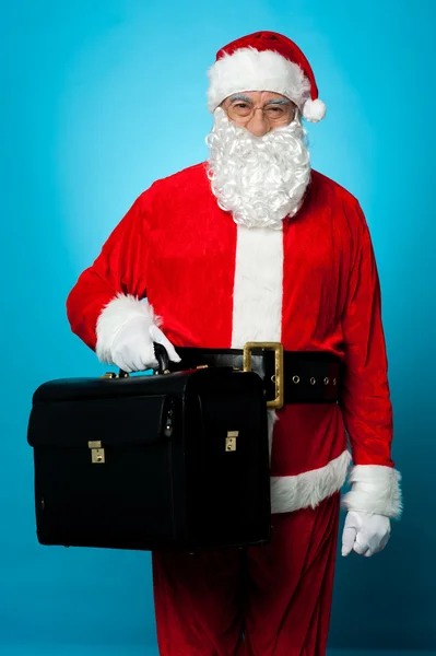 Santa is all set to visit his new office, holding briefcase — Stock Photo, Image