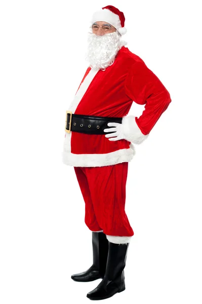 Confident Santa with a big belly posing sideways — Stock Photo, Image