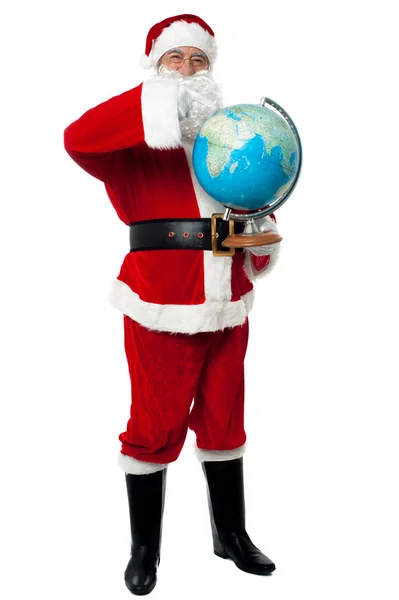 Babbo Natale indica un continente sul globo — Foto Stock