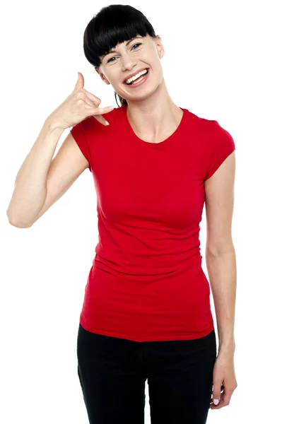 Cheerful brunette gesturing a mock call — Stock Photo, Image