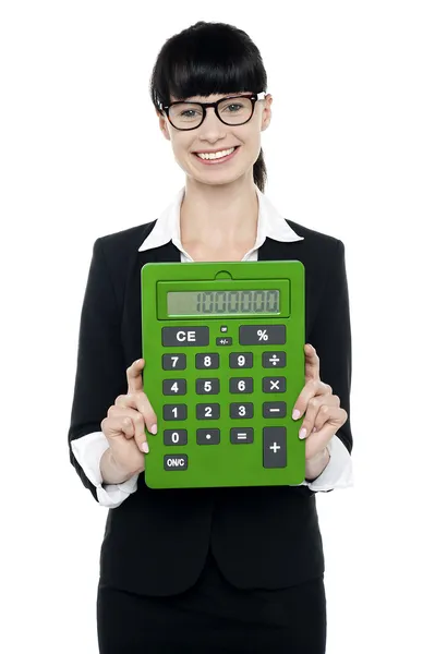 Pretty female executive showing calculator — Stock Photo, Image