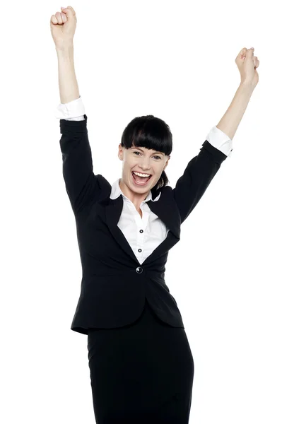 Jubilant corporate lady throwing up her hands — Stock Photo, Image