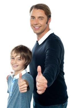 Confident father and son duo gesturing thumbs up clipart