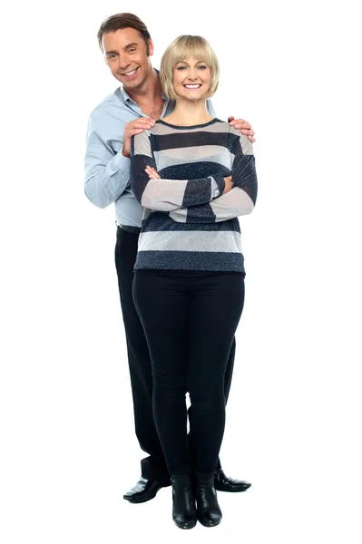 Middle aged husband holding his wife from behind — Stock Photo, Image