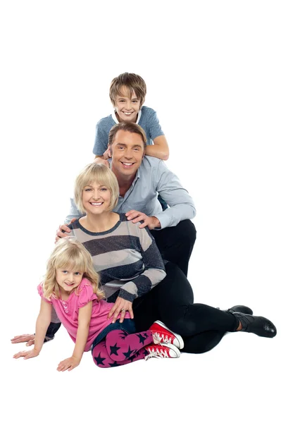 Closely bonded family in a studio — Stock Photo, Image