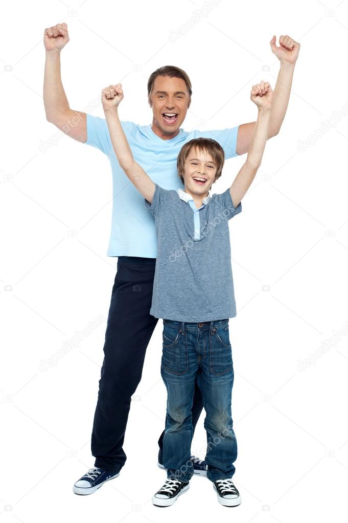 Father and son celebrating their success